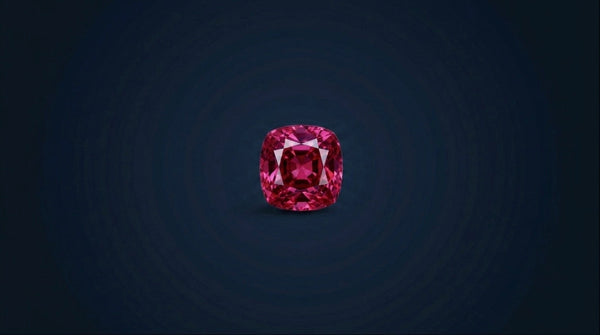 Natural untreated Mogok spinel cushion cut loose gemstone on navy background
