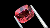 Vivid pink cushion-cut natural spinel gemstone from Mogok, Myanmar, displayed on a luxurious black background. Sourced by a trusted UK-based supplier.