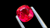 Stunning neon red-pink cushion-cut spinel gemstone, showcasing vibrant brilliance and flawless clarity, ideal for custom jewellery design.