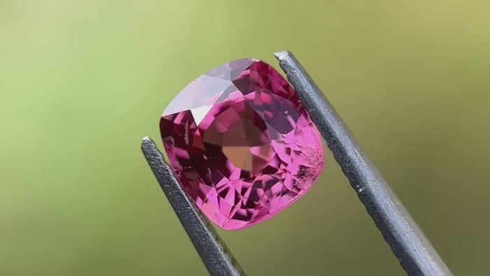 Video showcasing a 1.16-carat medium intense pink natural spinel gemstone. Features detailed views highlighting its exceptional clarity and vibrant colour, perfect for bespoke jewellery and unique engagement rings. Sourced from Mogok, Myanmar.