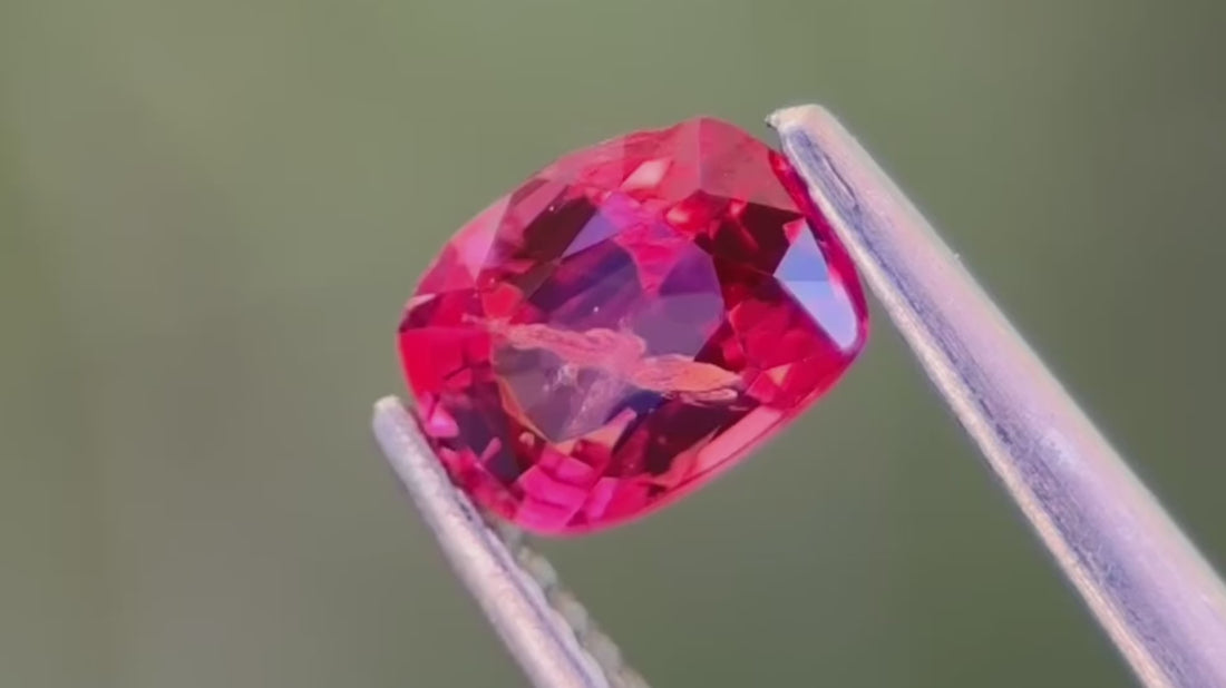 0.50ct Reddish-Pink natural spinel with visible inclusions from Mogok, Myanmar, hand-cut for unique jewellery designs.