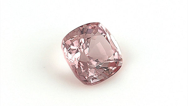 Unique 1.78-carat pale brown natural spinel, cushion-cut, dimensions 7x6.7x4.7mm. Photographed indoors with a gemlight box to enhance its rare colour and clarity, suitable for bespoke fine jewellery.