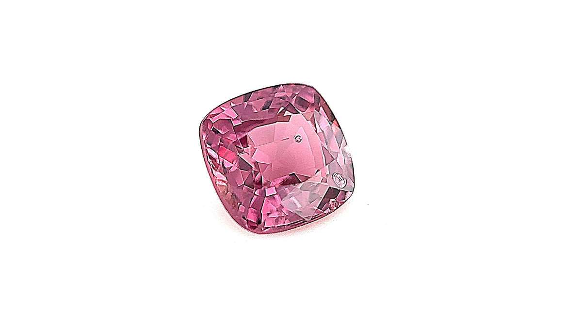 Ethically sourced Burma gemstone, pink natural untreated spinel, durable August birthstone, captured indoors with gemlight box lighting. Perfect for high-quality bespoke jewellery.