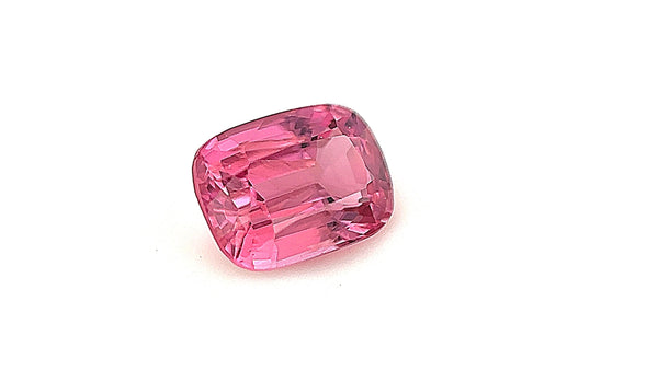 Close-up of a vivid pink spinel, 0.95ct, captured in a gemlight box to highlight its brilliance and eye-clean clarity. A stunning choice for millennials and Gen Z looking for a unique engagement ring.